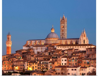 Italy, Siena, City at sunset with the cathedral in the background