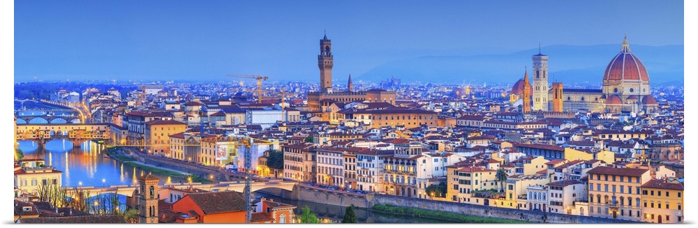 Italy, Tuscany, Firenze district, Florence, City illuminated at dusk.