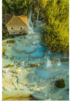 Italy, Tuscany, Maremma, Saturnia, The Saturnia Thermal Baths Surrounded By Trees