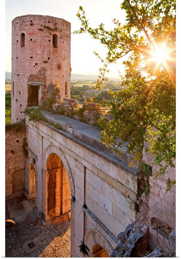 Italy, Umbria, Mediterranean area, Perugia district, Spello, Porta Venere (gate) and Torri di Properzio (towers) at sunset