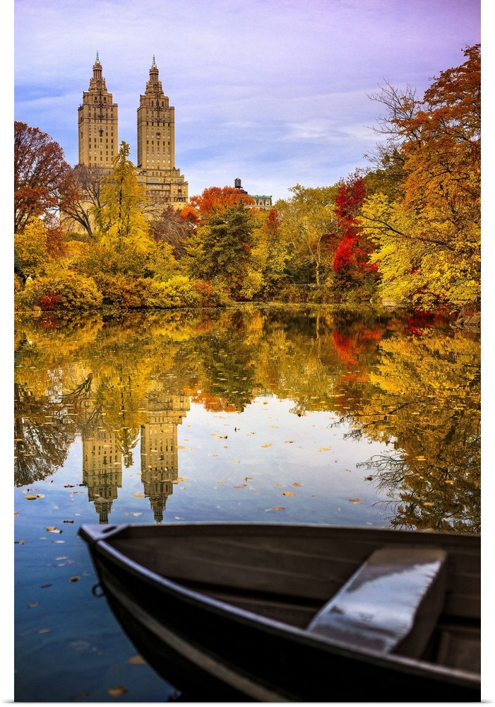USA, New York City, Manhattan, Central Park, Boat and San Remo apartment building in the foliage