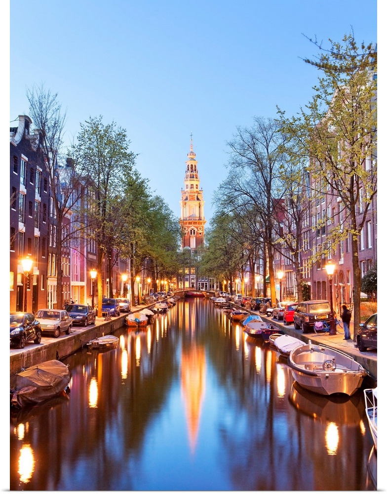 Netherlands, North Holland, Benelux, Amsterdam, Montelbaan Tower at Oude Schans illuminated at dusk.