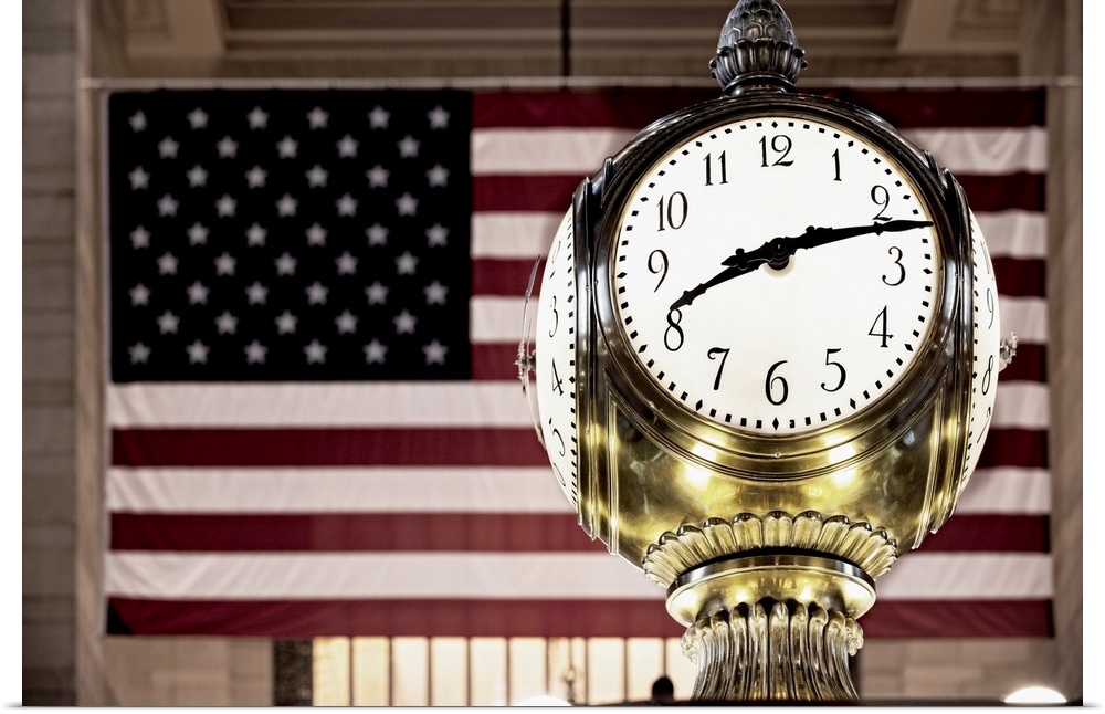 USA, New York City, Manhattan, Midtown, Grand Central Station, Brass Clock and the US flag.