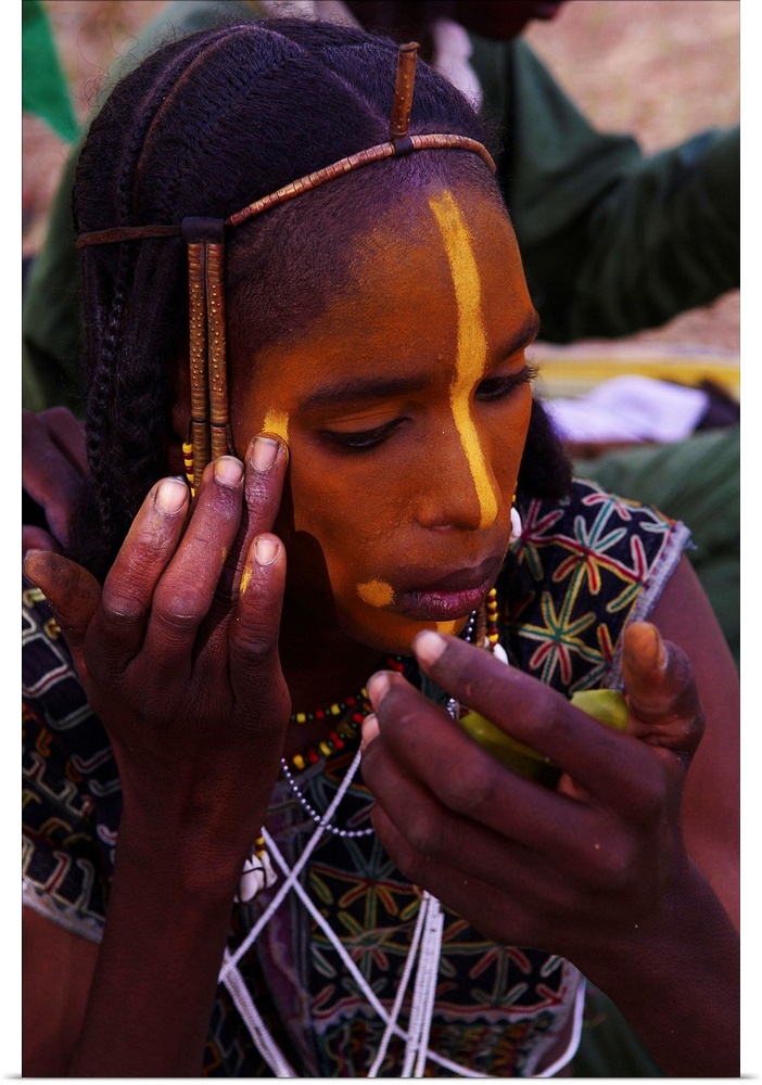 Niger, Wodaabe-Bororo men with face painted for the annual Gerewol male beauty contest