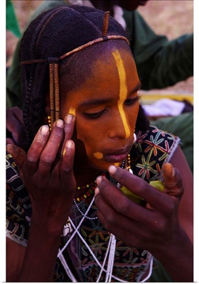 Niger, Wodaabe-Bororo men with face painted for the annual Gerewol male beauty contest