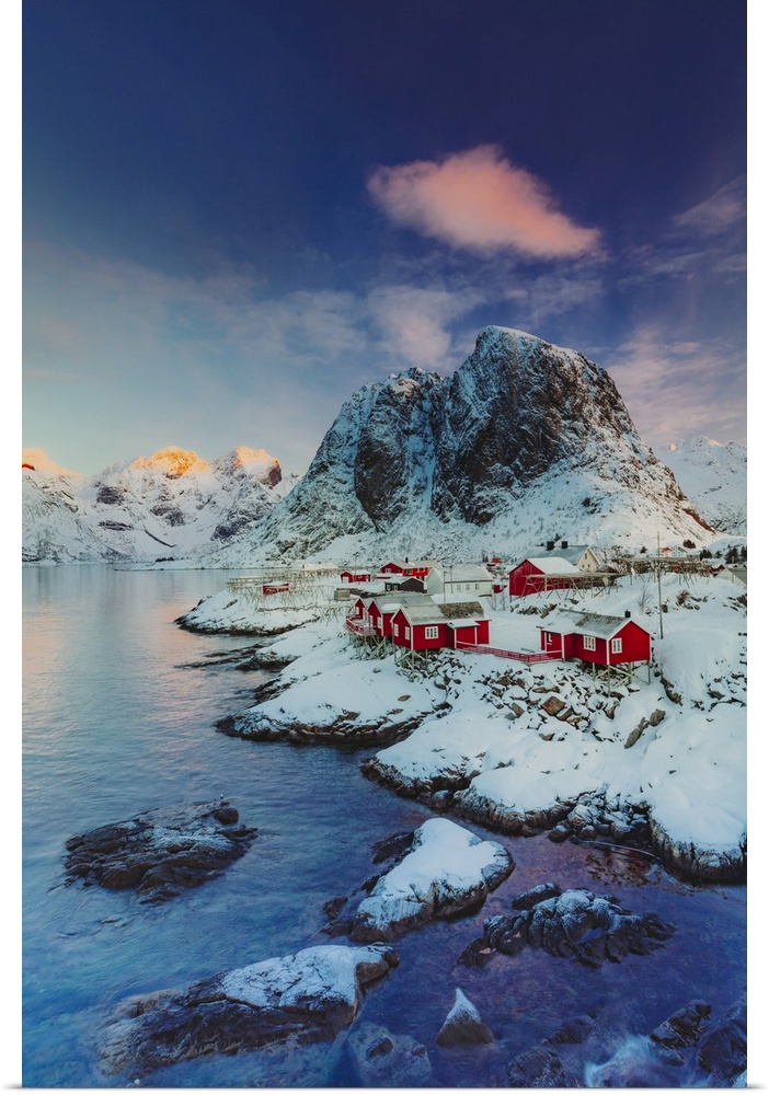 Norway, Nordland, Lofoten Islands, Moskenesoya, Scandinavia, Sun rising on the little village of Hamnoy near Reine, one of...