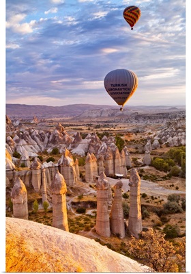 Turkey, Cappadocia, Goreme, Hot air balloons over the Honey Valley at sunrise