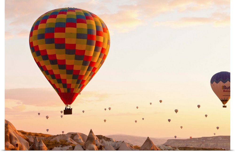 Turkey, Central Anatolia, Cappadocia, Hot air balloons at sunset.