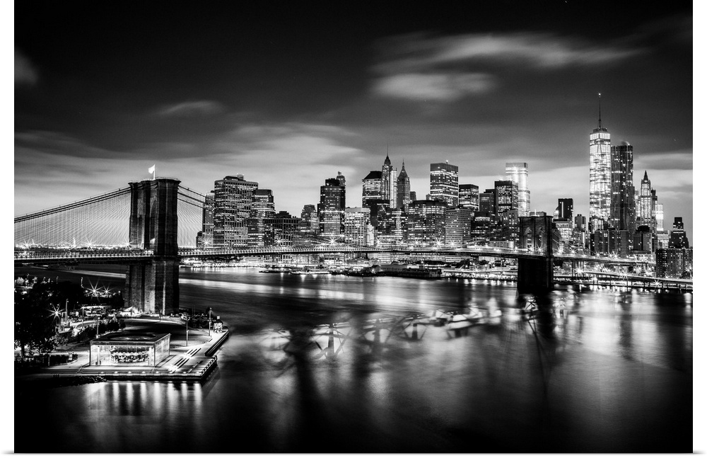 USA, New York City, Brooklyn Bridge and Manhattan skyline with One World Trade Center at sunrise.