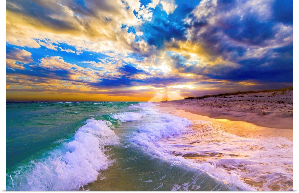 Breaking waves over a blue beach under a sunset in Florida.