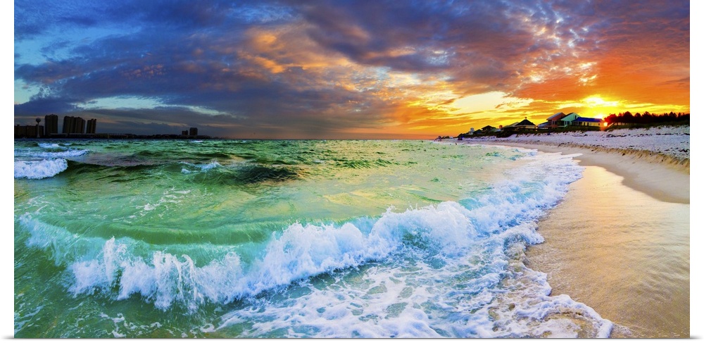 Beautiful ocean sunset with crashing waves and a vibrant red sunset on the beach. Makes a great panoramic canvas print.