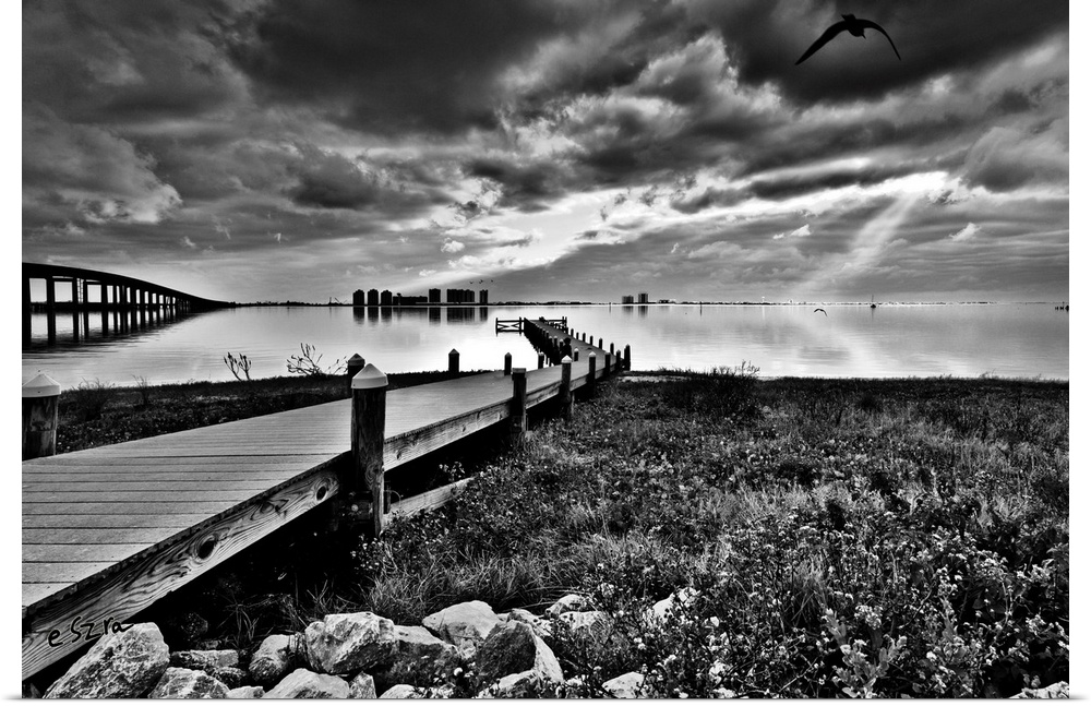 A black and white landscape of the fishing pier at Navarre children's park, Florida.