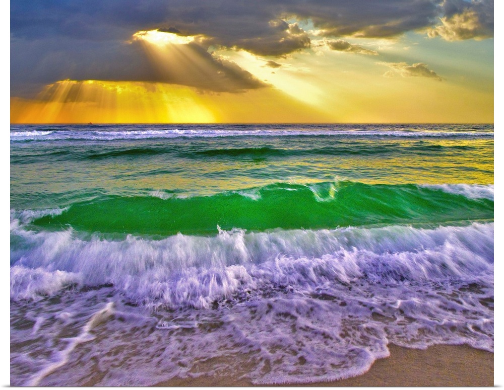 Emerald green breaking waves at sunset crash under golden sunrays. Taken in Fort Walton Beach Florida.