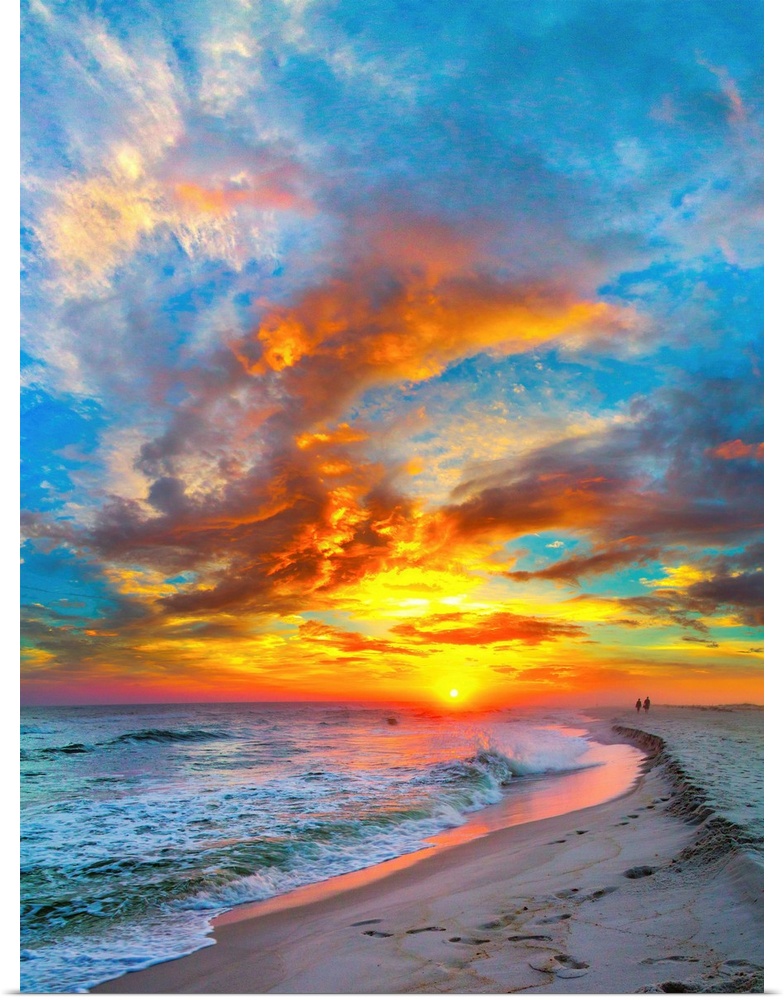 A dark shoreline before a bright burning red sunset.  Landscape taken on Navarre Beach, Florida.