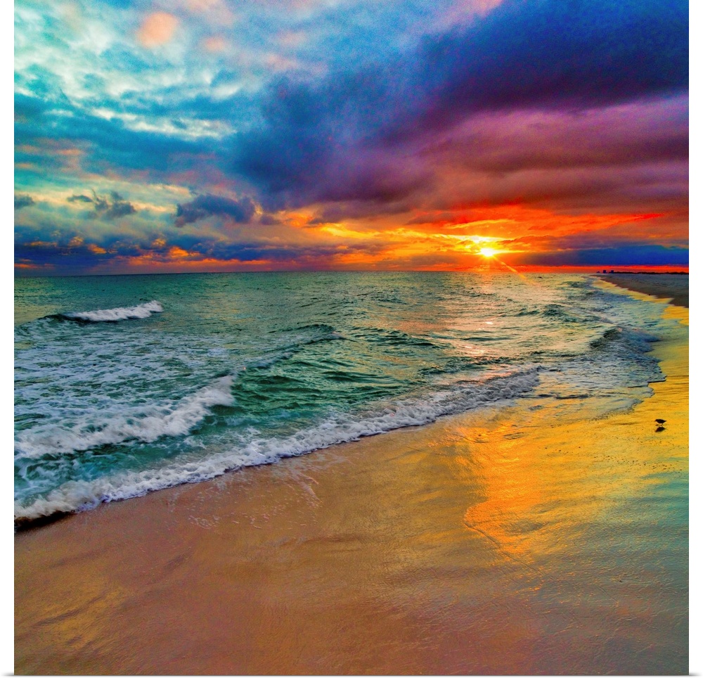 A square image of the sun descending over the ocean amid bright, technicolor clouds.