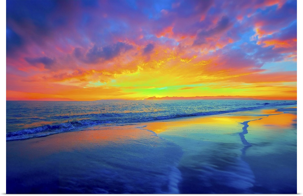 The pink and red twilight sky is reflected in the blue waters below. Waves caress the beach in this dreamy dark landscape.