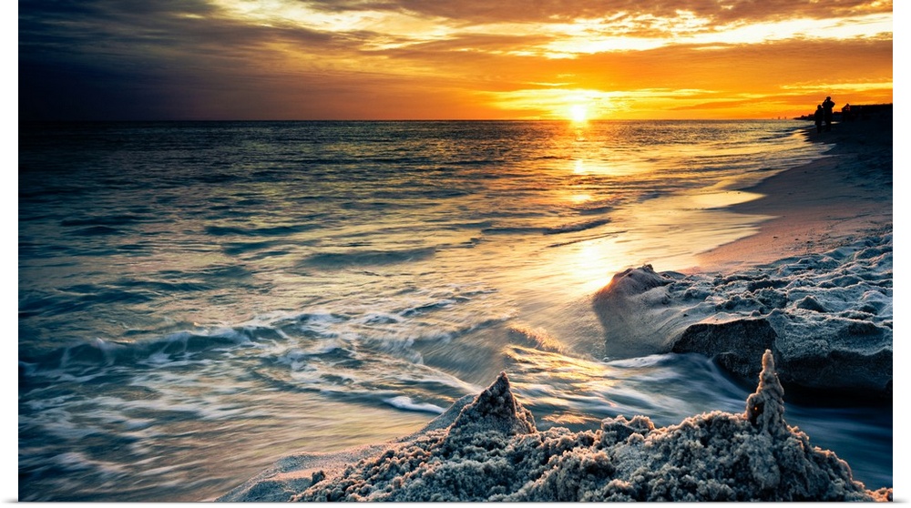 A drip sandcastle in a Destin Florida Sunset on the beach.