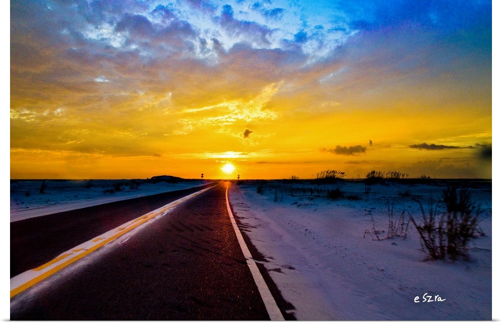 A landscape driving into the sunset on the open road.