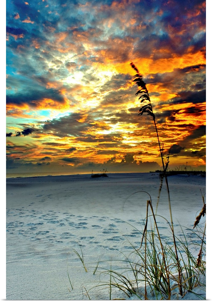 A fiery red sunset on a beach in Destin, Florida.