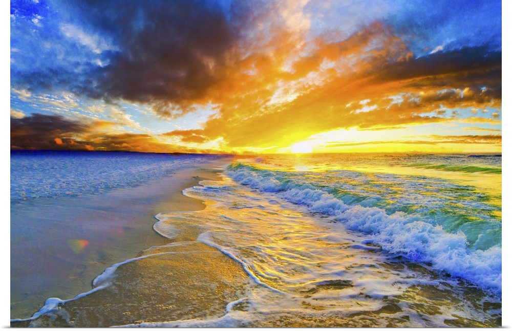 A bright orange and blue sunset over a beautiful beach. Green and gold ocean waves roll across the sea shore.