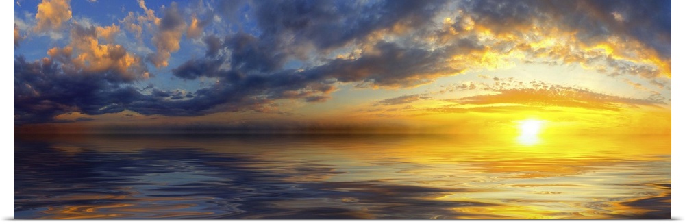 A beautiful panoramic sunset with bright yellow clouds and a golden cloudscape reflected in the sea.