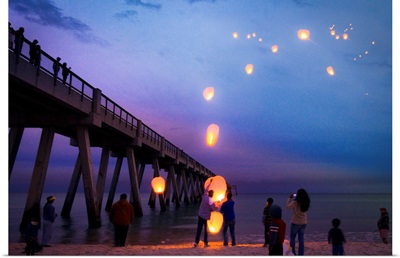 Releasing Paper Lanterns Over Sea-Blue Seascape