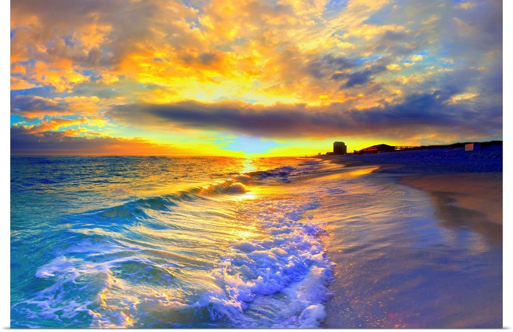 A beautiful yellow sunrise with foaming ocean waves striking the beach. Yellow clouds burst into the sky over a beautiful ...