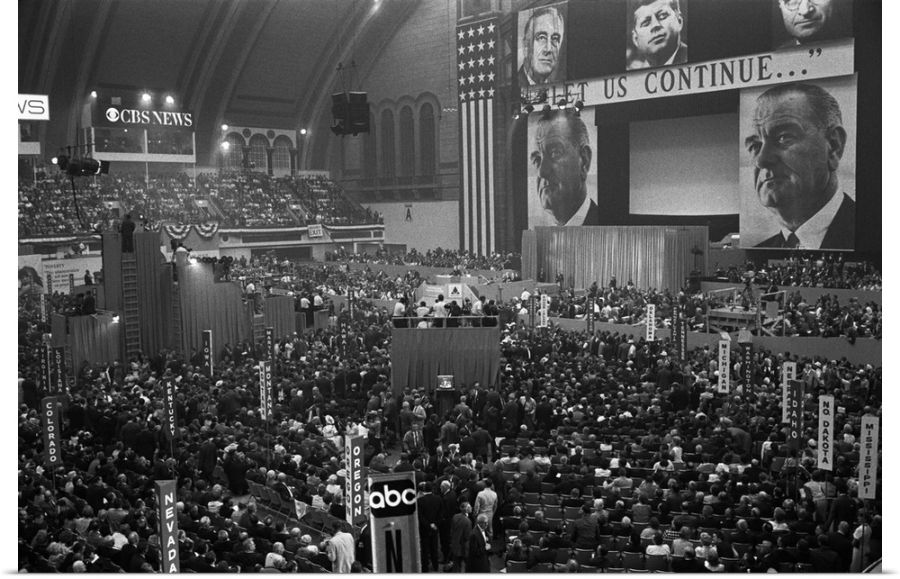 1964 Democratic Convention, Atlantic City, New Jersey. View of delegates and large pictures of John F. Kennedy, Harry Trum...