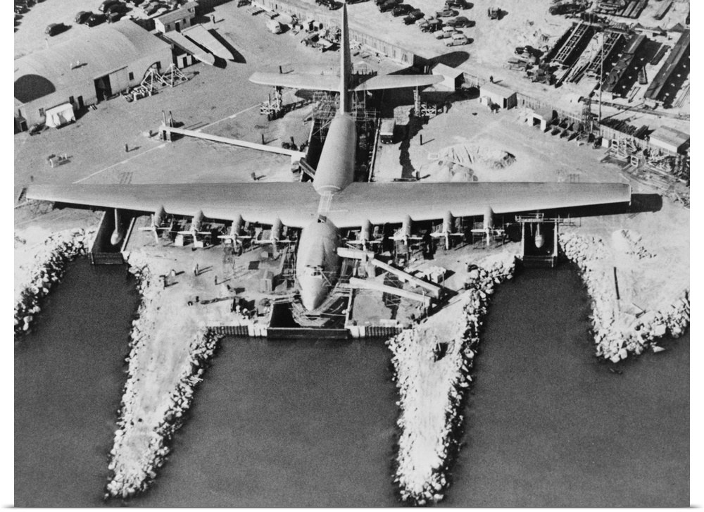 Aerial view of Hughes Flying-boat seaplane under construction at its dock in Long Beach, 1947. The prototype was named 'Hu...