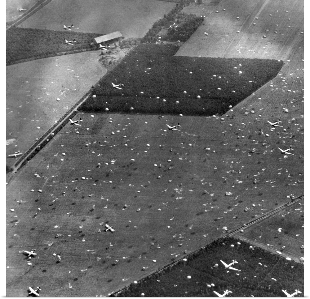 Allied planes drop paratroopers onto Holland's fields already dotted with gliders and airborne troops. Sept. 17, 1944. Fie...