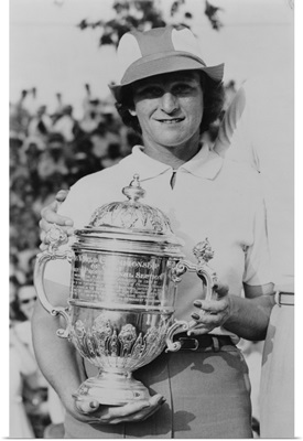 Babe Didrikson Zaharias holding trophy after the Tam O'Shanter golf tournament