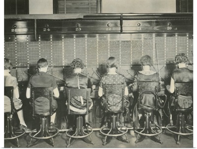 Back view of young women telephone switchboard operations. Washington