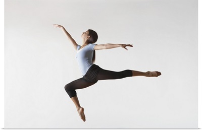 Ballerina Leaping In Mid-Air