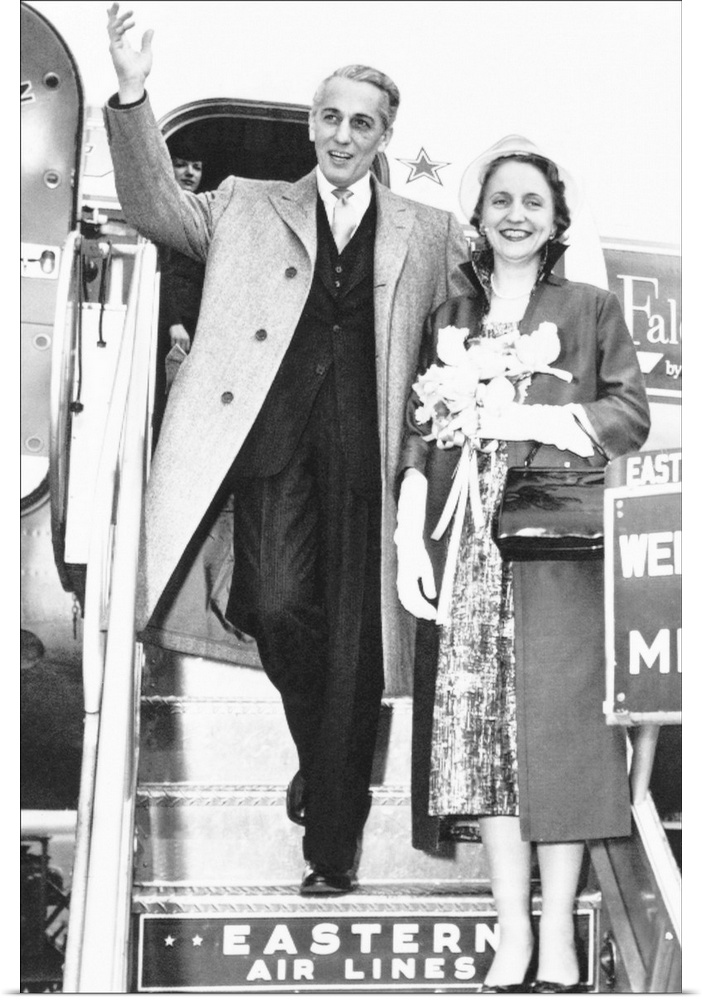 Clifton Daniel, Jr. waves to crowd gathered at Miami to see his new bride, former Margaret Truman. The couple were enroute...
