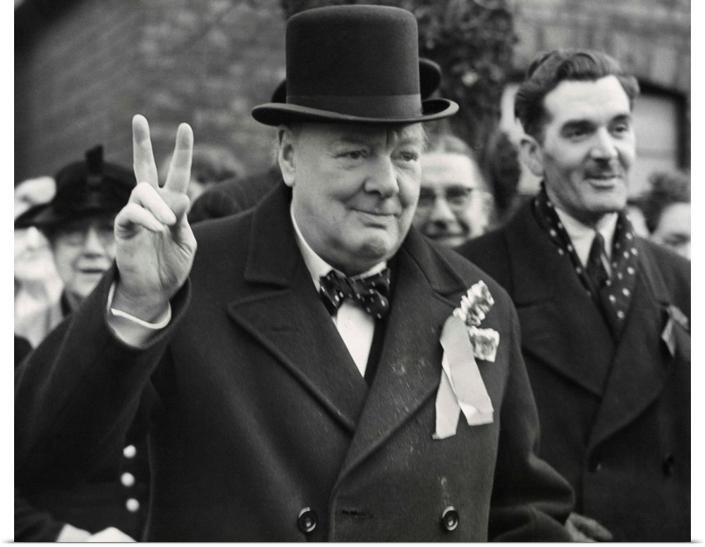 Conservative Party Leader Winston Churchill gives his familiar victory sign. He was making a last-minute campaign tour bef...