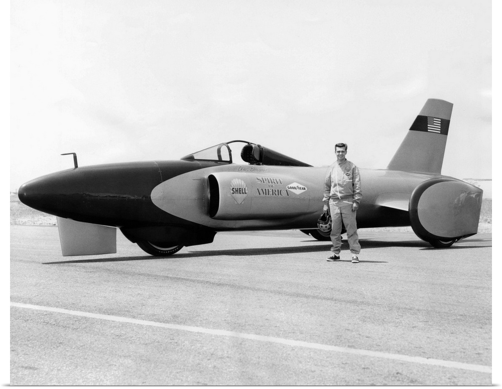 Craig Breedlove stands beside his jet car 'Spirit of America' on the Bonneville Salt Flats in Utah. July 25, 1963. Breedlo...
