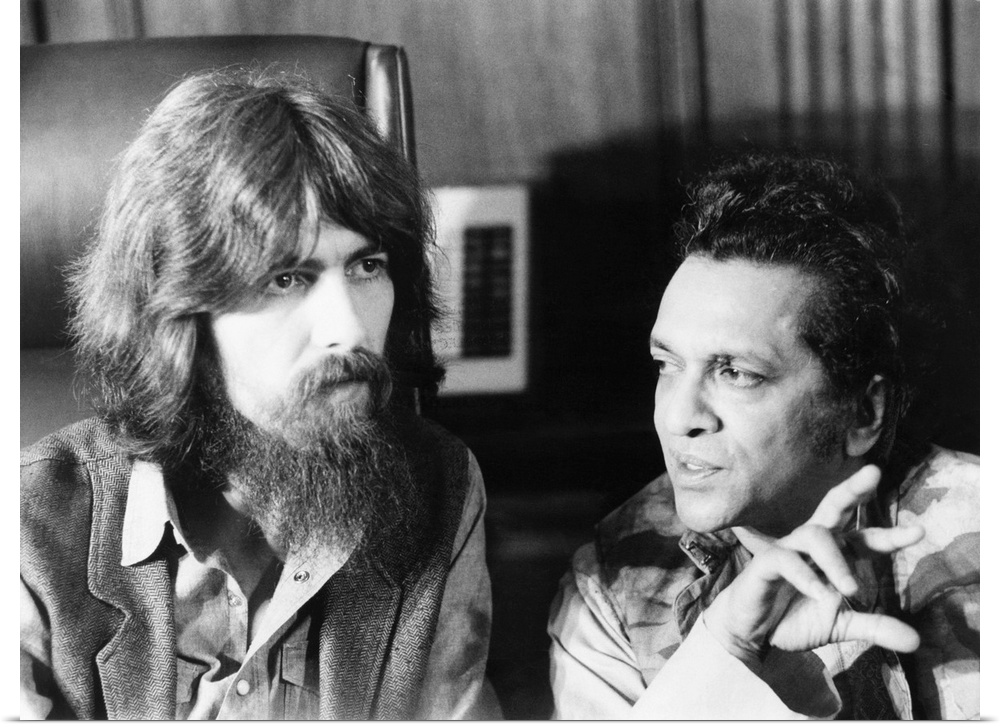 Former Beatle George Harrison and Indian musician Ravi Shankar talk to newsmen in New York. July 27, 1971. Their planned c...