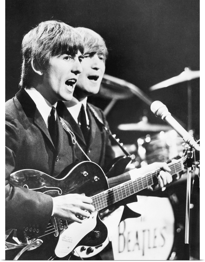 George Harrison and John Lennon of the Beatles. c. 1964.