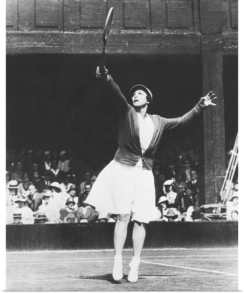 Helen Wills Moody returning a high one during her match with Mrs. J.P. Macready of England. July 4, 1933. Wills Moody won ...