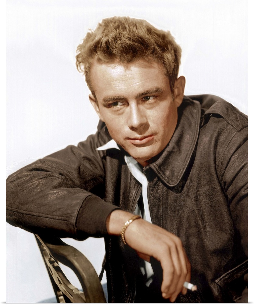 A vintage photograph of the actor James Dean leaning against a chair, to promote his film "Rebel Without a Cause."