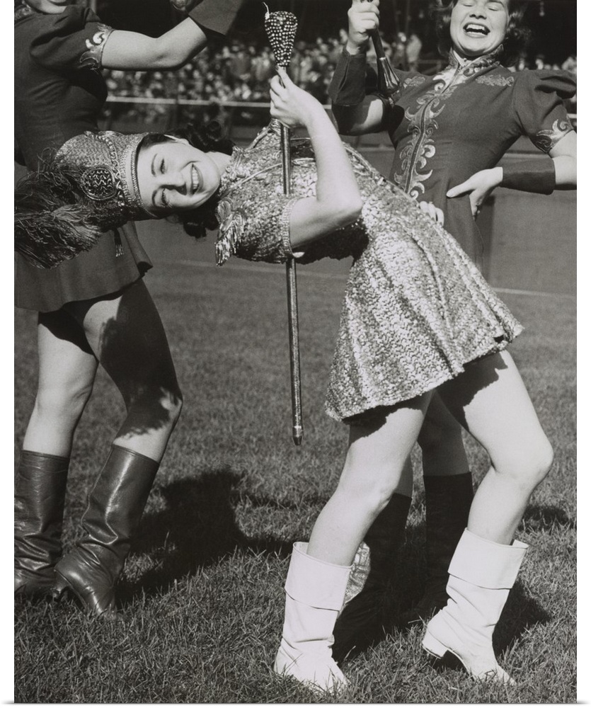 Lead majorette, doing a back bend while holding a baton. Nov. 22, 1939. New York City.