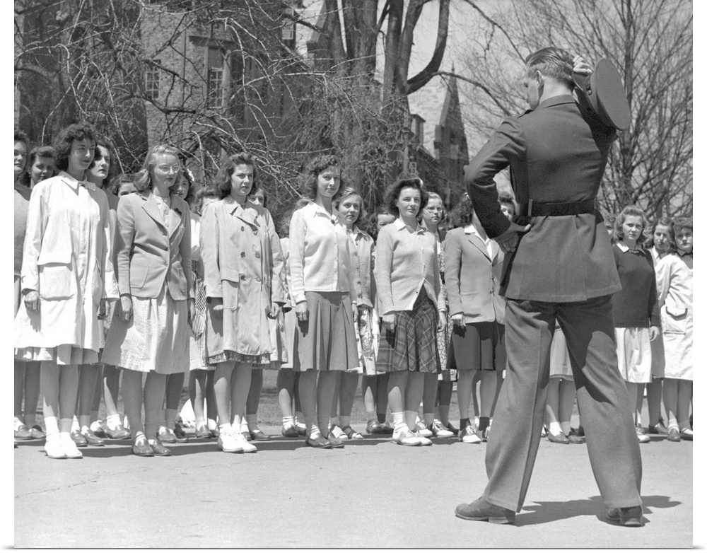 Drill Instructor looks over new arrivals to Marine Corps Women's Reserve Officer's Candidate School. Ca.1945.