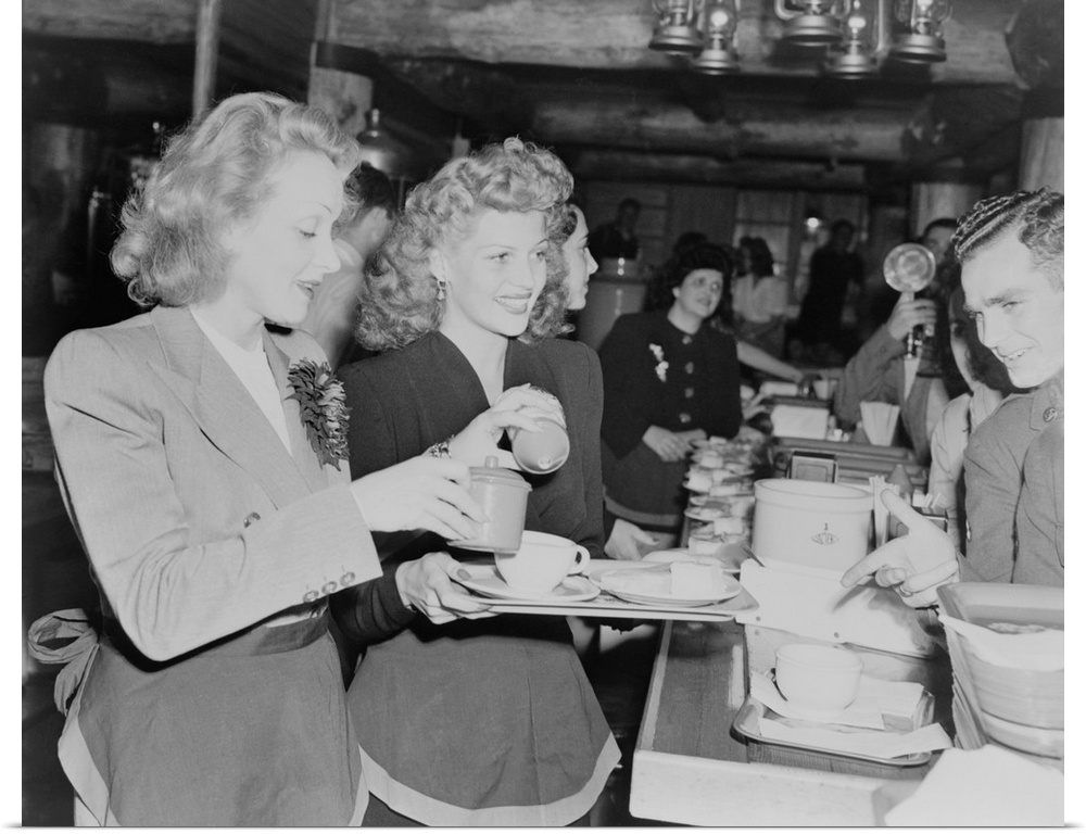 Marlene Dietrich and Rita Hayworth serve soldiers at the Hollywood Canteen during World War II. Nov. 17, 1942.