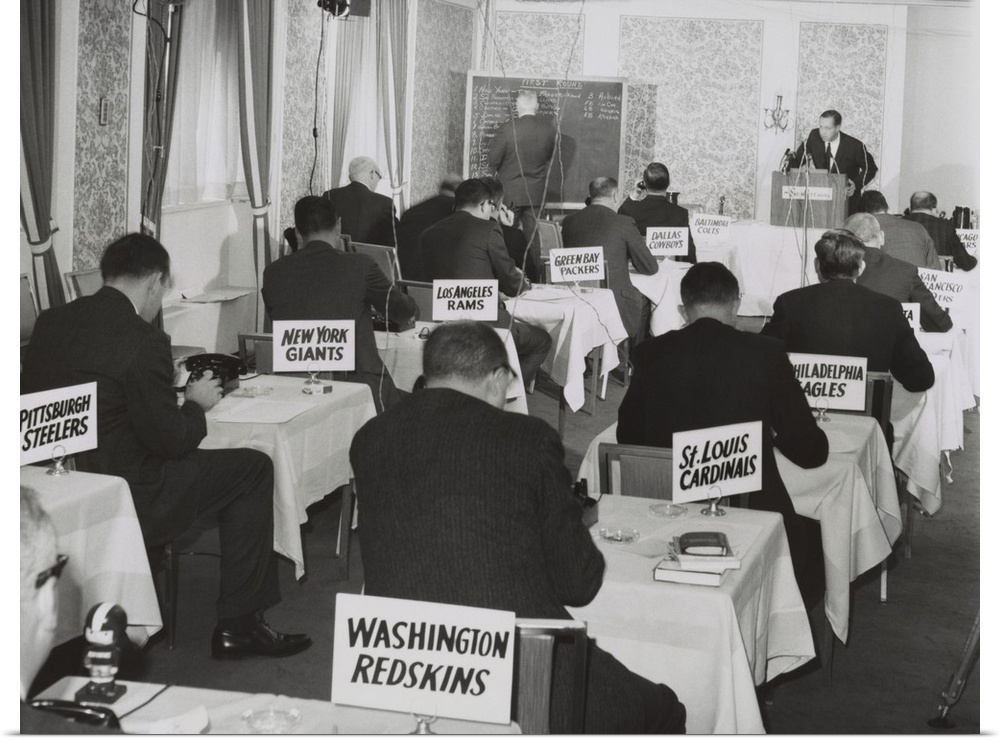 National Football League draft meeting in New York, Nov. 28, 1964. Commissioner Pete Rozelle reads the picks as representa...
