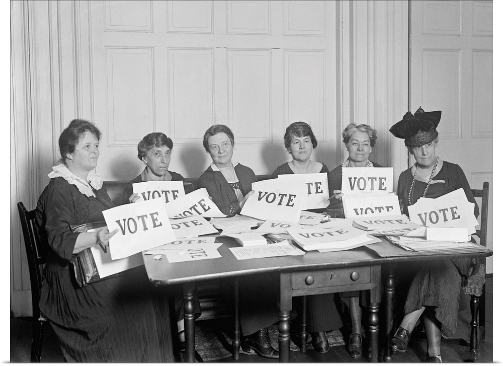 National League of Women Voters hold up signs reading, 'VOTE', Sept. 17, 1924. Millions of women voted in 1920 and 1924, b...