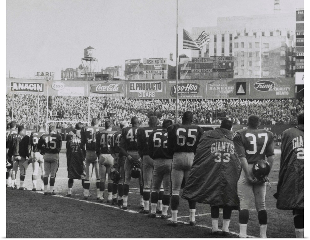 New York Giants football team during a moment of prayer for President John Kennedy. Nov. 24, 1963. The game was well atten...