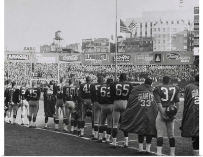 New York Giants football team during a moment of prayer for President John Kennedy