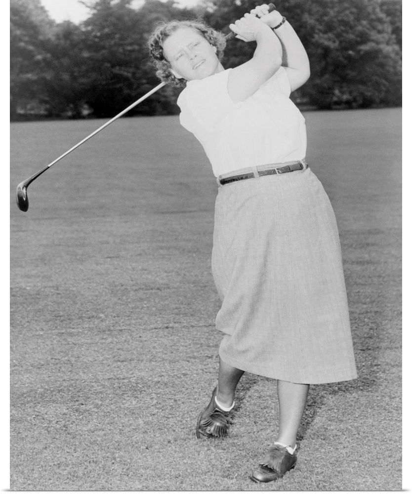 Patty Berg playing golf in 1951. She was a founding member and player on the LPGA Tour. She won 15 major titles from 1940 ...