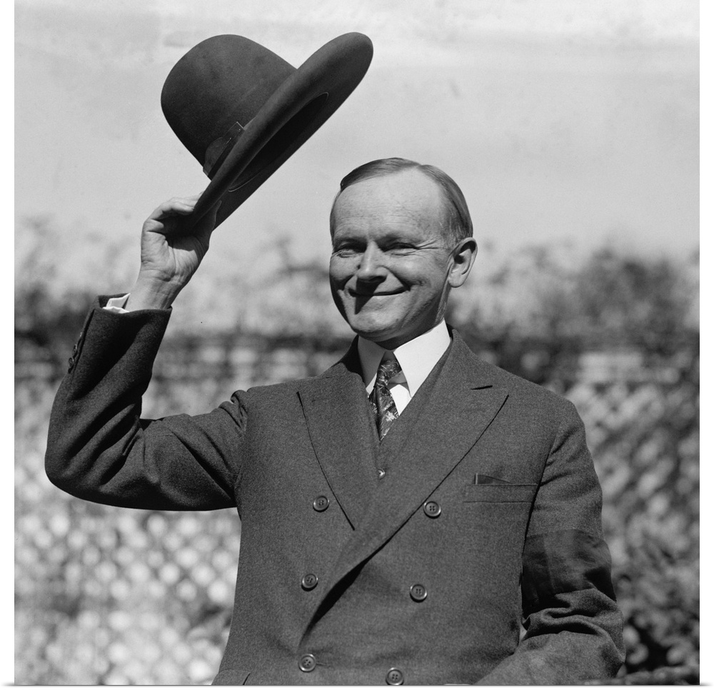 President Calvin Coolidge waves a hat presented to him by Smoki People of Prescott, Arizona. c. Sept-Oct. 1924.
