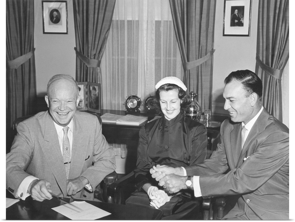 President Eisenhower with Champion Golfer Ben Hogan and his wife in the Oval Office. Aug. 8, 1953
